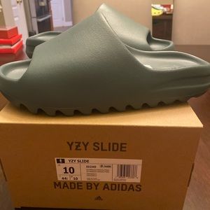 Yeezy Slides. Brand new. Original packaging. Men’s 10. Marine Blue